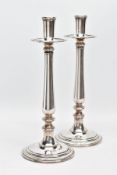 A PAIR OF PLAIN DESIGNED STAINLESS-STEEL CANDLESTICKS, signed to the base 'GTS, Sambonet, Italy'