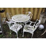 A WHITE PAINTED CAST ALUMINIUM GARDEN TABLE with circular pierced top 80cm in diameter and four