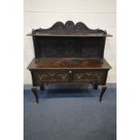 A 19TH CENTURY OR EARLIER OAK SIDEBOARD with a later raised back on fluted supports, carved with