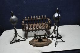 A CAST IRON FIRE BASKET with scrolled rear slats, open front, two fire dogs, a small tripod stand