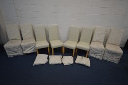 A SET OF EIGHT HOMA GARDEN FURNITURE CREAM FAUX LEATHER DINING CHAIRS, with removable floral covers