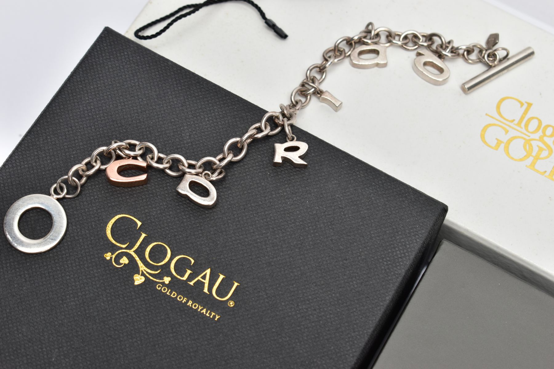 THREE ITEMS OF CLOGAU SILVER JEWELLERY, to include a 'Cariad' hinged bangle with rose gold detail to - Image 2 of 4