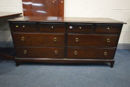 A STAG MINSTREL SIDEBOARD with four short drawers over four long, width 156cm x 47cm x height 71cm