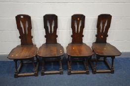 A SET OF SIX EARLY TO MID 20TH CENTURY OAK ECCLESIASTICAL CHAIRS (splits to seat and back of some