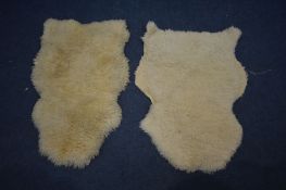TWO SHEEPSKIN RUGS