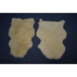 TWO SHEEPSKIN RUGS