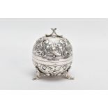 A LATE VICTORIAN SILVER STRING BOX, of spherical outline, embossed with scrolling acanthus leaf
