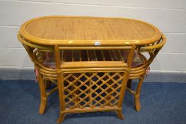 A MODERN BAMBOO OVAL TABLE with an undertier, width 102cm x depth 53cm x height 77cm, with two