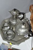 SIX PIECES OF 1920'S HAMMERED FINISH PEWTER, comprising a four piece 'Craftsman Pewter' tea set, a