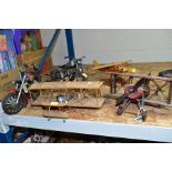 THREE WOODEN AND METAL AIRCRAFT AND TWO METAL MODEL MOTORCYCLES, the aircraft fitted to be displayed