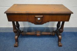 A LATE VICTORIAN WALNUT SIDE TABLE, with a small central drawer, turned supports and fluted supports