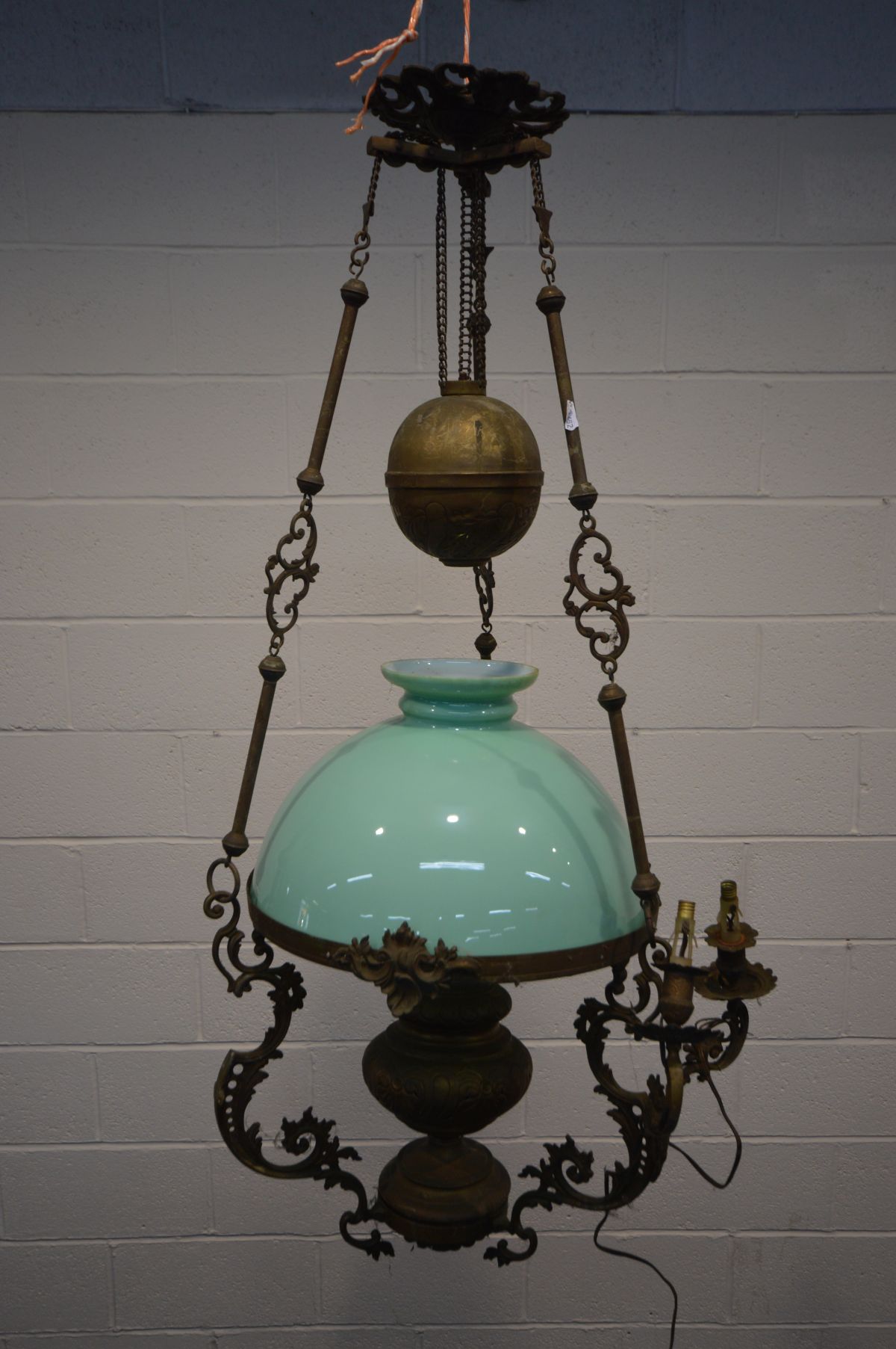A VICTORIAN FRENCH BRASS OIL CHANDELIER, with rise and fall movement, later wiring and pale green
