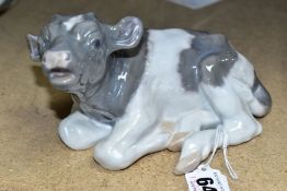 A ROYAL COPENHAGEN FIGURE OF A RECUMBENT CALF, model no 1072, printed and painted green and blue