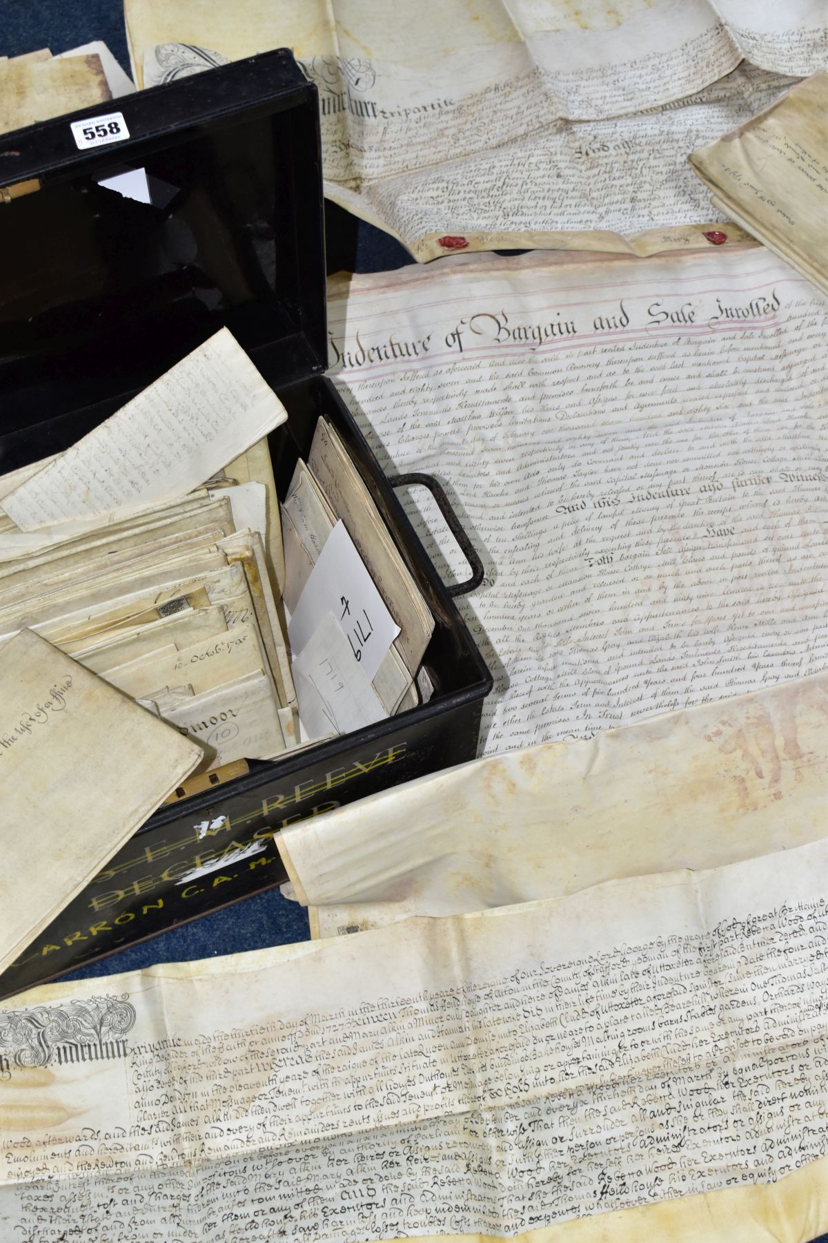 INDENTURES, a metal deed box containing approximately 70-80 legal documents, indentures,