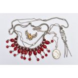 FOUR ITEMS OF JEWELLERY, to include a niello chain necklace, a red glass necklace, an oval silver