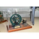 A CASED HANDBUILT SCALE MODEL OF A COOMBER LIVE STEAM ROTARY ENGINE OF 1876, not tested, powering