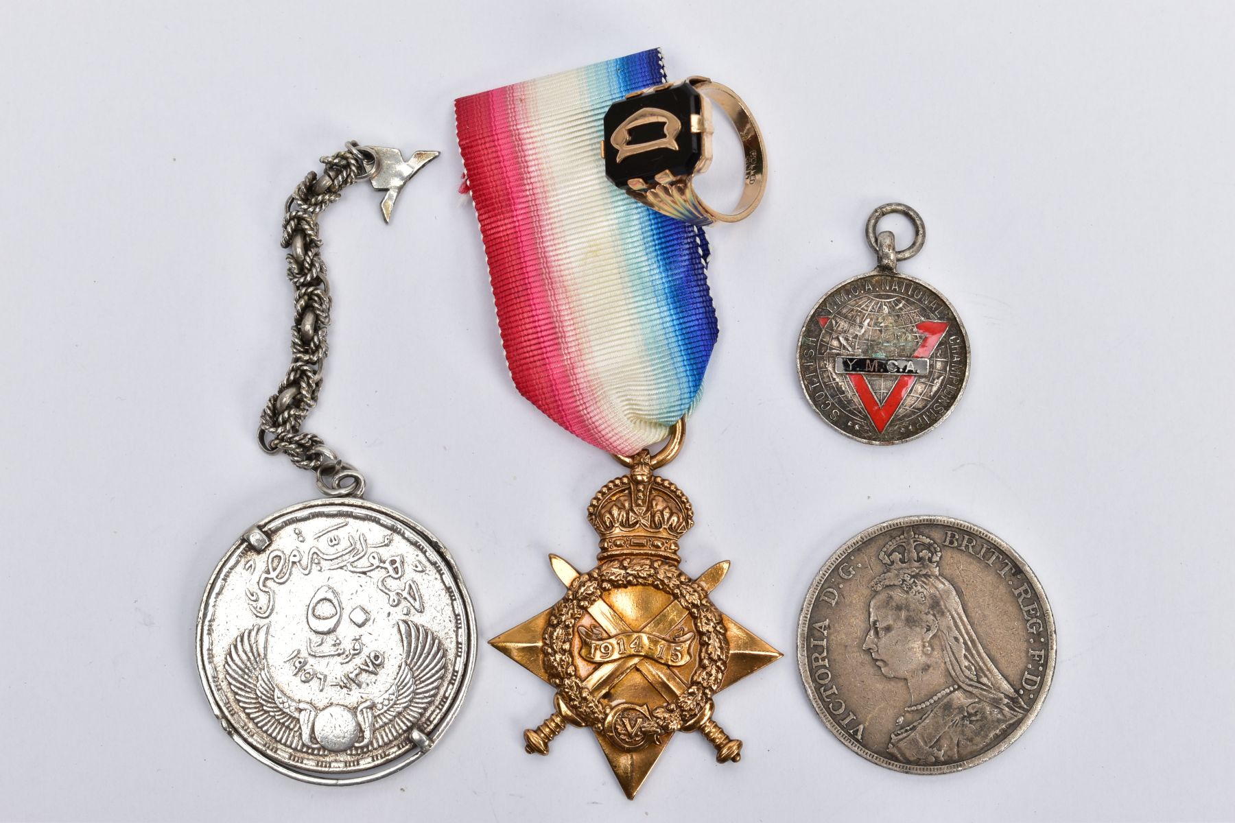 FIVE MISCELLANEOUS ITEMS, to include a rolled gold signet ring, a YMCA medal, a mounted Egyptian