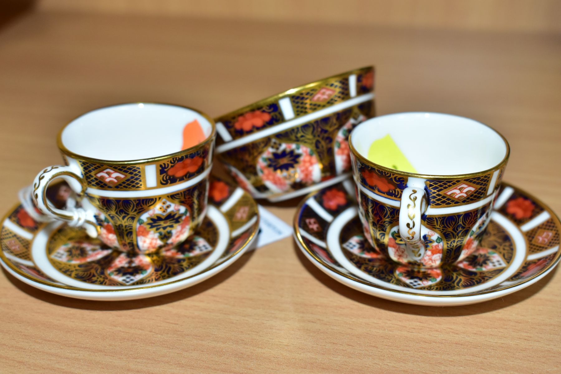 ROYAL CROWN DERBY MINIATURE TEAWARES, '1128' pattern, comprising of two tea cups both XLVII, one - Image 4 of 4