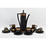 A PORTMEIRION COFFEE SET by Susan Williams-Ellis with gilt Greek key border decoration, on a black