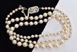 A GRADUATED CULTURED PEARL NECKLACE, pearls measuring from 3mm to 8mm, to the rectangular diamond