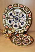 A ROYAL CROWN DERBY IMARI TEA CUP AND SAUCER AND A SHAPED SQUARE PLATE, the tea cup and saucer in