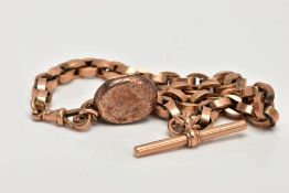 A ROSE GOLD ALBERT CHAIN, an oval link Albert chain, fitted with a 'T' bar and oval locket,
