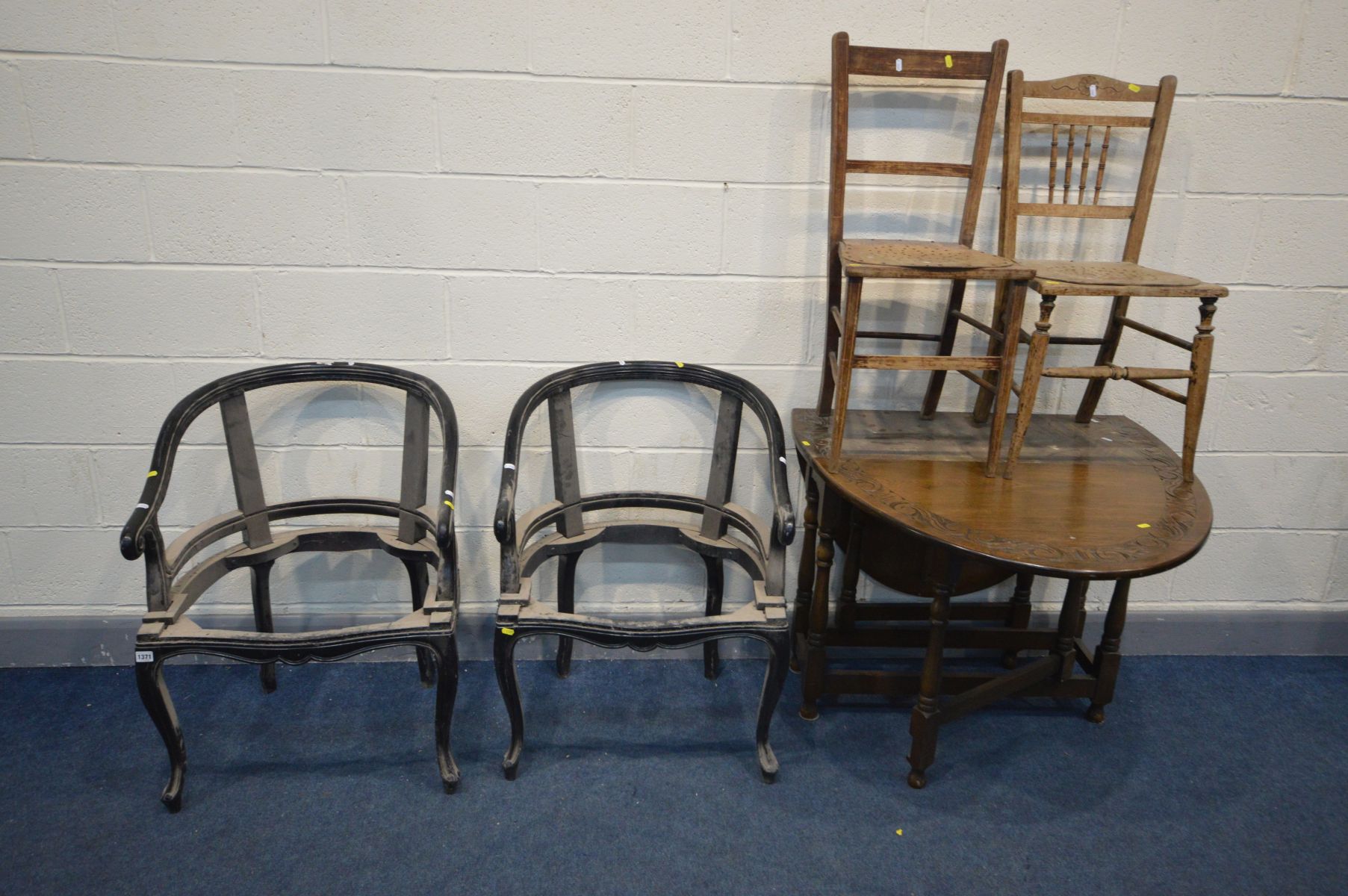 A PAIR OF EBONISED FRENCH STYLE TUB CHAIRS (no upholstery) along with an oak gate leg table and