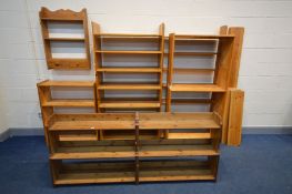 A QUANTITY OF PINE OPEN BOOKCASES, to include five tall bookcases (one dismantled) two low bookcases