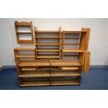A QUANTITY OF PINE OPEN BOOKCASES, to include five tall bookcases (one dismantled) two low bookcases