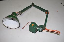 A VINTAGE INDUSTRIAL ARTICULATED WORKSHOP LAMP with a 6 1/2in green and white enamelled shade, a