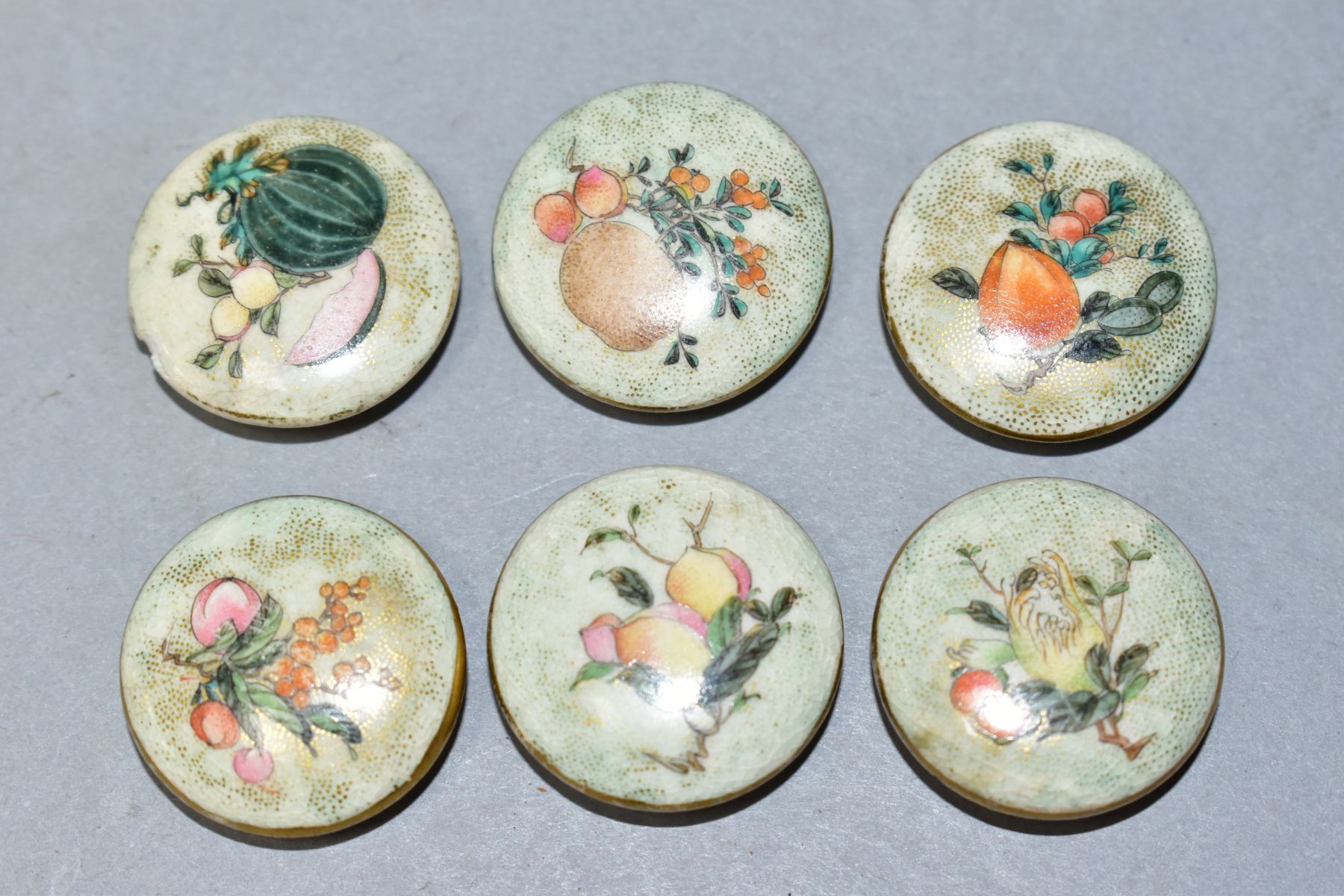 A SET OF SIX LATE 19TH/EARLY 20TH CENTURY JAPANESE SATSUMA POTTERY BUTTONS, painted with fruits