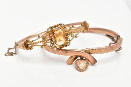 TWO LATE VICTORIAN GOLD BANGLES, a citrine and seed pearl filigree hinged half hoop bangle and a