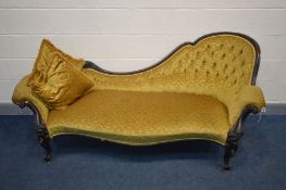 A VICTORIAN MAHOGANY CHAISE LONGUE, gold buttoned upholstery, foliate scrolled frame on cabriole