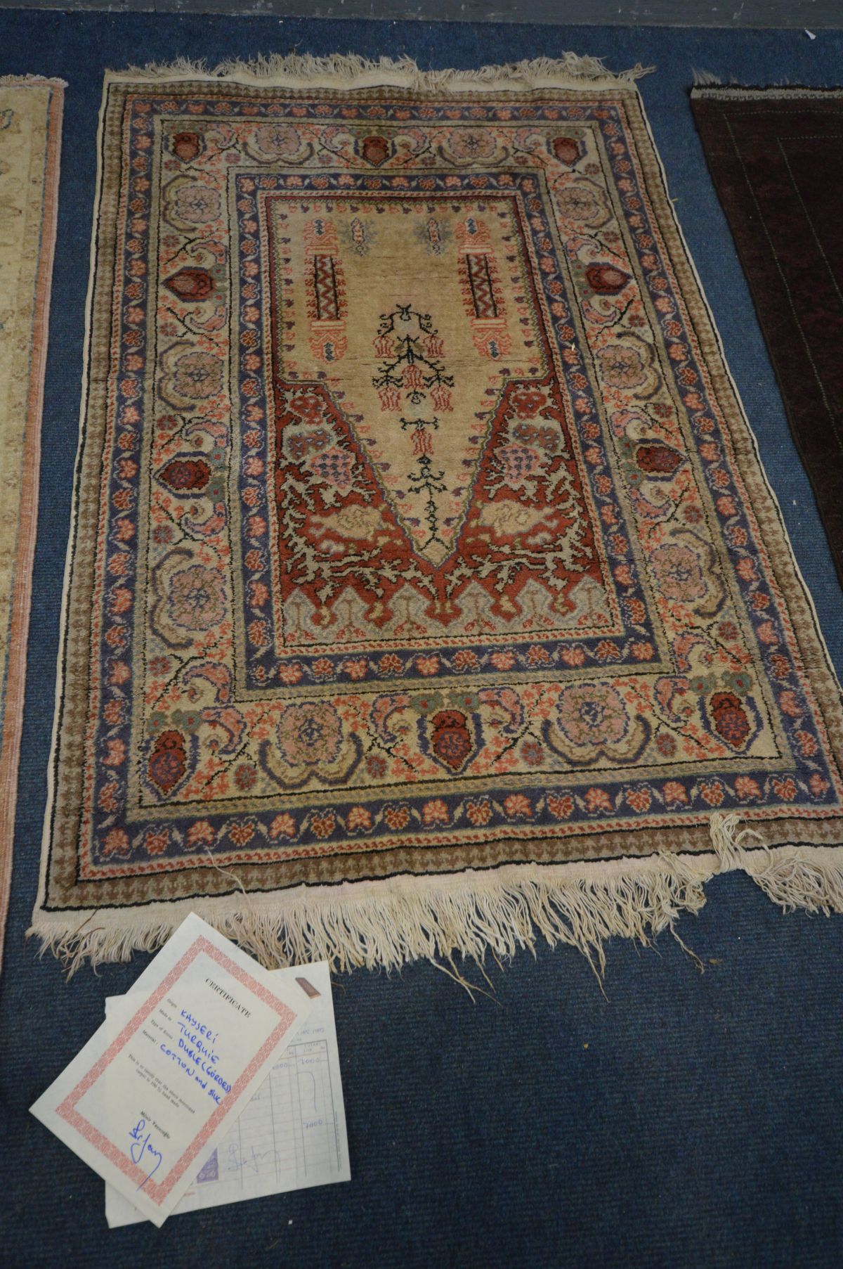 A SILK AND COTTON KAYSERI RUG, 137cm x 92cm, a similar red rug, and another rug (3) - Image 2 of 5