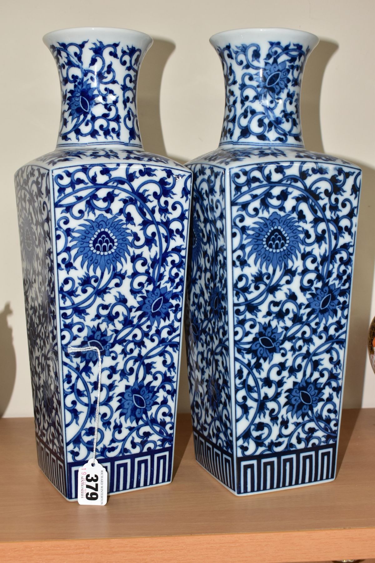 A PAIR OF 20TH CENTURY ORIENTAL PORCELAIN BLUE AND WHITE TRANSFER PRINTED VASES OF TAPERING SQUARE