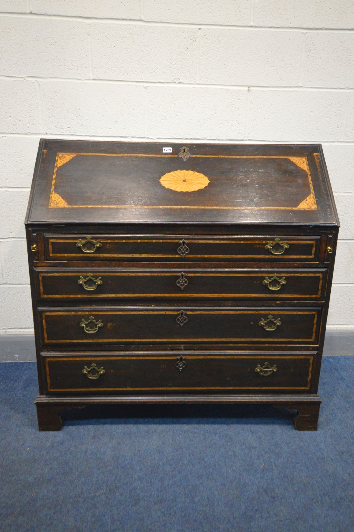 A GEORGIAN MAHOGANY AND INLAID BUREAU, fitted interior above four drawers, on bracket feet, width