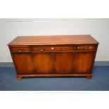 A MAHOGANY SIDEBOARD with three drawers, width 154cm x depth 46cm x height 78cm