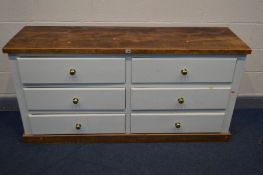 A PARTIALLY WHITE PAINTED PINE AND HARDWOOD CHEST OF DRAWERS/SIDEBOARD, made up of six long drawers,