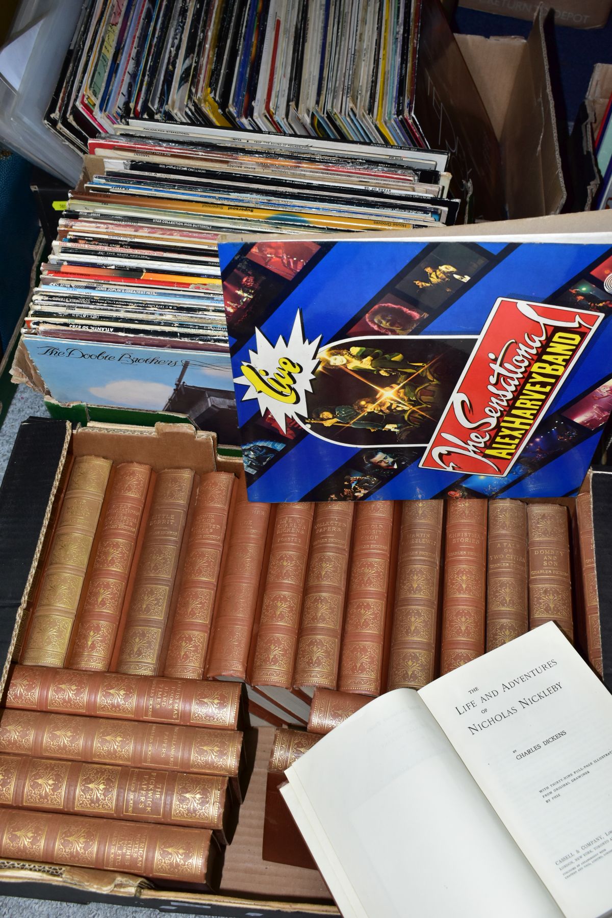 TWO TRAYS CONTAINING OVER ONE HUNDRED AND FIFTY LPS AND COVERS, along with a tray of Charles Dickens