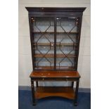 A LATE 19TH CENTURY ASTRAGAL GLAZED TWO DOOR BOOKCASE, blind fretwork decoration, three adjustable