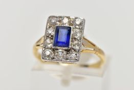 A GOLD EARLY TWENTIETH CENTURY SAPPHIRE AND DIAMOND RECTANGULAR CLUSTER RING, a step cut sapphire