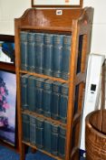 AN EARLY 20TH CENTURY OAK FOUR TIER OPEN BOOKSHELF CONTAINING AN EIGHTEEN VOLUME CHARLES DICKENS