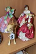 A BESWICK CAMEL MODEL NO 1044 TOGETHER WITH THREE ROYAL DOULTON LADIES, comprising 'Autumn