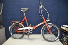 A UNIVERSAL VINTAGE FOLDING BIKE with 3 speed gears, dynamo connected to front and rear lights, 17in