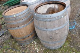 A PAIR OF MODERN OAK BARRELS with galvanised banding height 88cm and 60cm diameter at top and bottom