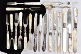 A SELECTION OF CUTLERY, to include three Edwardian mother of pearl handled cake knives and four