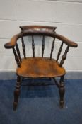 A VICTORIAN ELM SMOKERS CHAIR (slightly rickety)