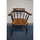 A VICTORIAN ELM SMOKERS CHAIR (slightly rickety)