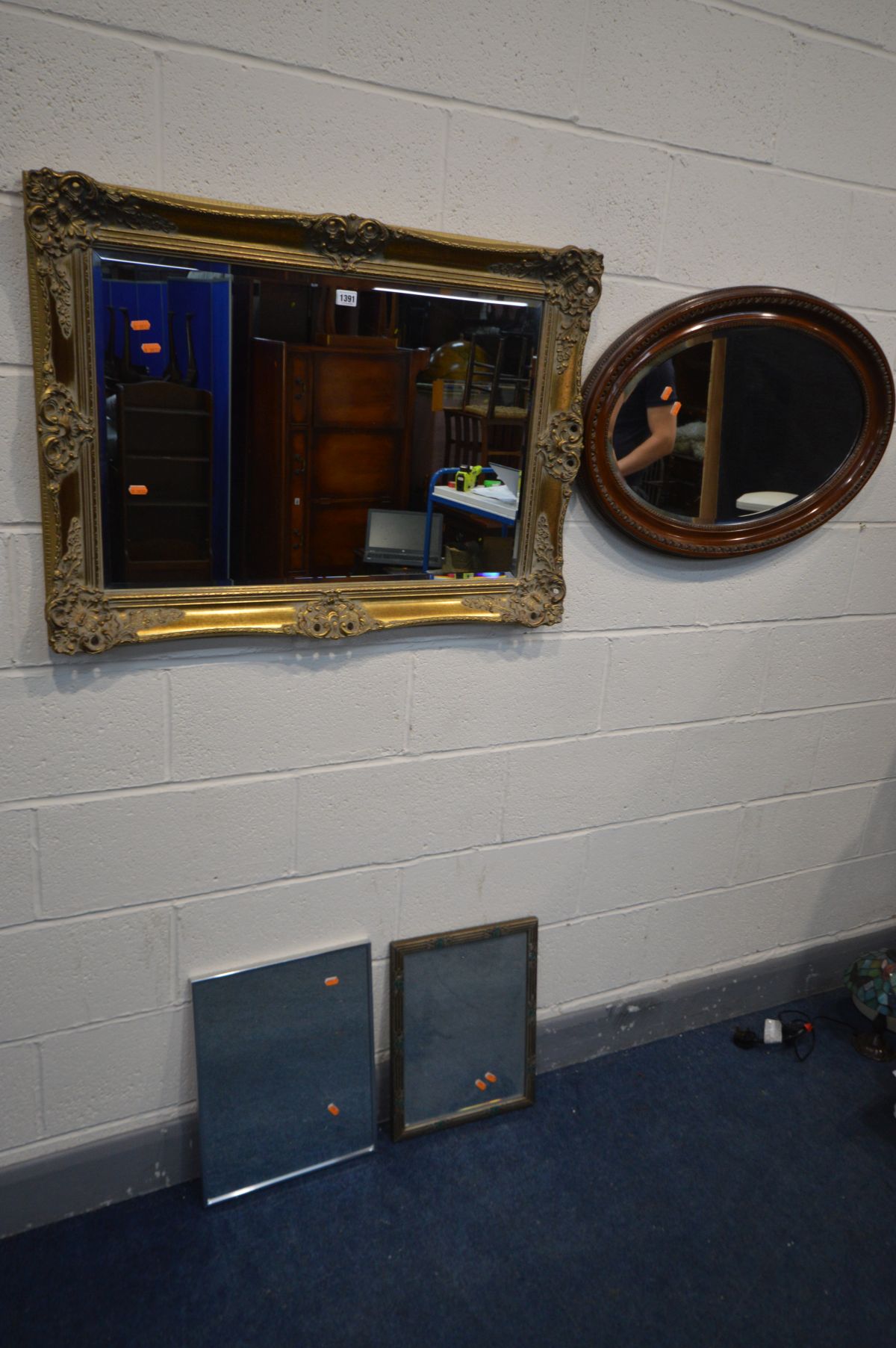 A GILTWOOD RECTANGULAR BEVELLED EDGE WALL MIRROR, 92cm x 67cm, together with an oval mahogany