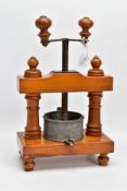 A 19TH CENTURY FRUITWOOD TABLE TOP FRUIT PRESS